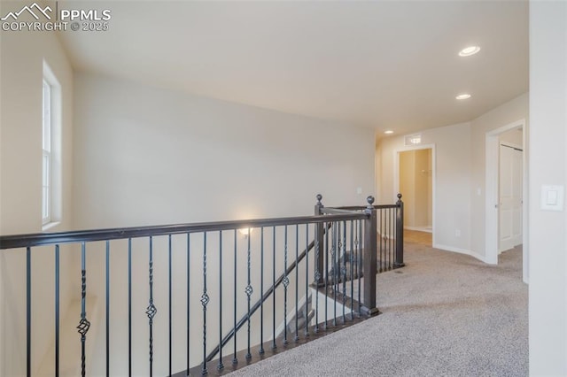 hallway with carpet floors