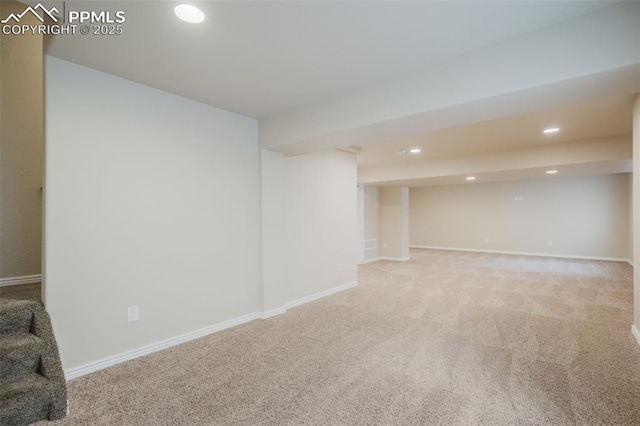 basement with light colored carpet