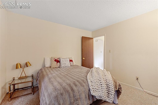 carpeted bedroom with a textured ceiling