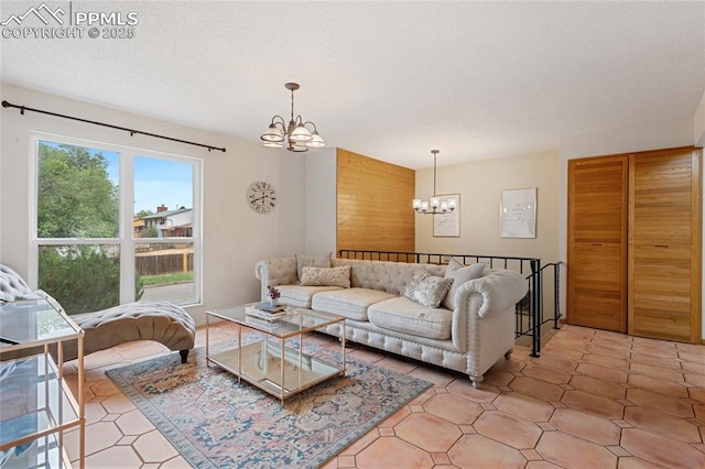 living room with a chandelier and a textured ceiling