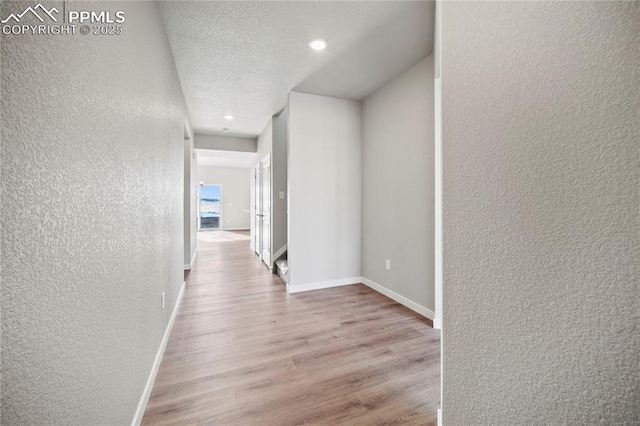 corridor featuring light hardwood / wood-style floors