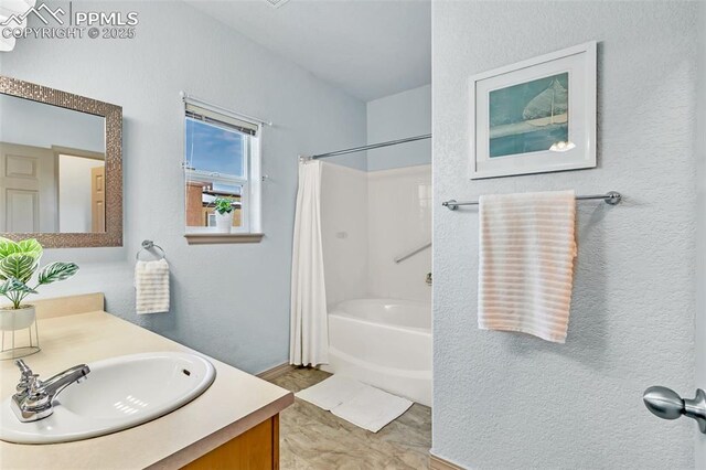 bathroom with shower / bath combination with curtain and vanity