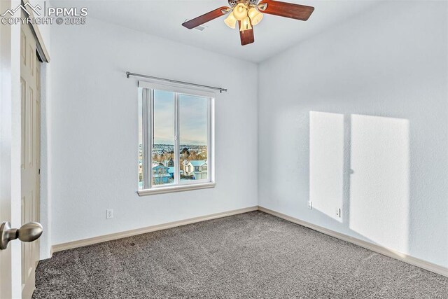 carpeted empty room with ceiling fan