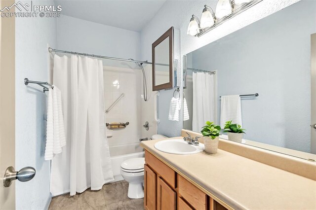 full bathroom featuring toilet, shower / bath combo, and vanity