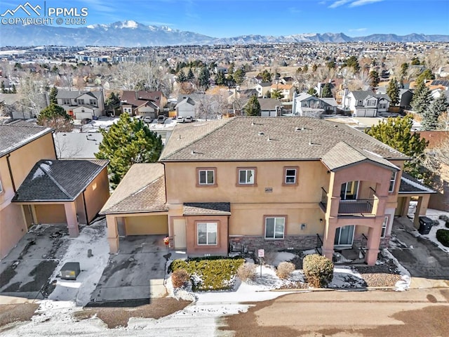 birds eye view of property featuring a mountain view