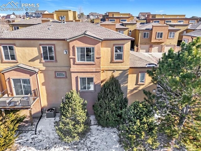 view of front of property with central AC unit