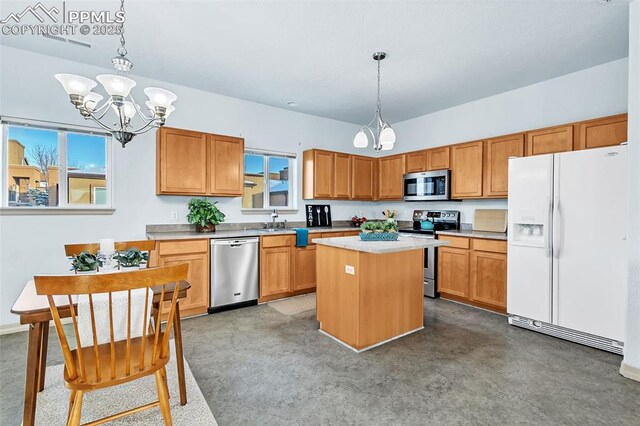 kitchen with a chandelier, stainless steel appliances, a center island, pendant lighting, and sink