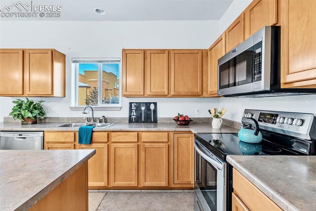 kitchen featuring sink and appliances with stainless steel finishes