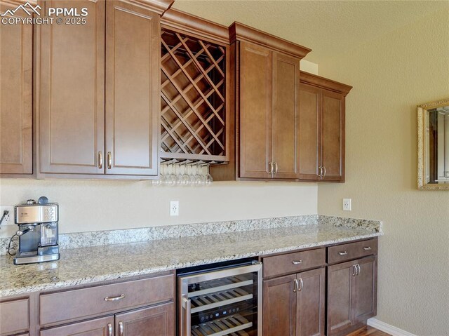 1235 Woodmoor Acres Dr, Monument, CO 80132 - kitchen with light stone counters and beverage cooler