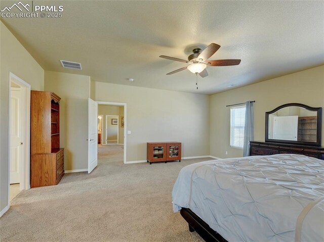 1235 Woodmoor Acres Dr, Monument, CO 80132 - bedroom with ceiling fan and light colored carpet