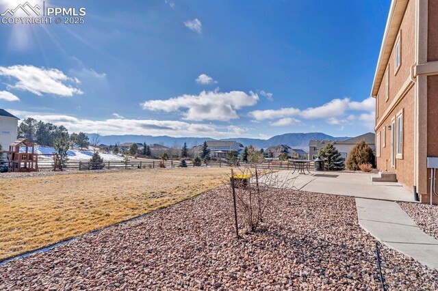 1235 Woodmoor Acres Dr, Monument, CO 80132 - view of yard featuring a mountain view and a patio area
