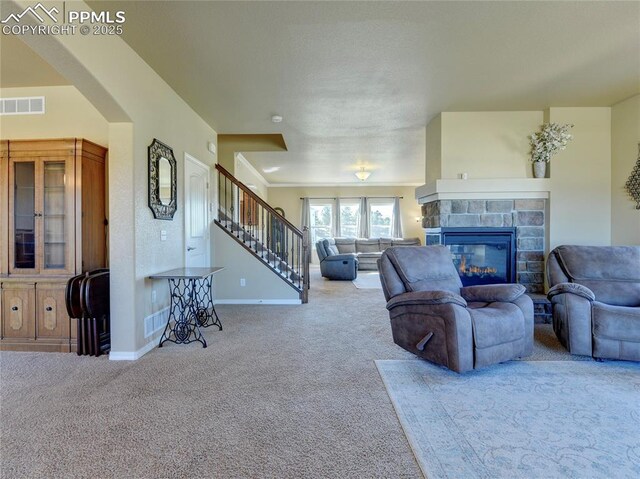1235 Woodmoor Acres Dr, Monument, CO 80132 - living room featuring carpet and a tile fireplace