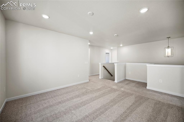 unfurnished room with light colored carpet