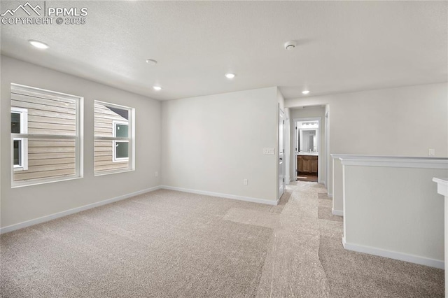 empty room featuring light carpet