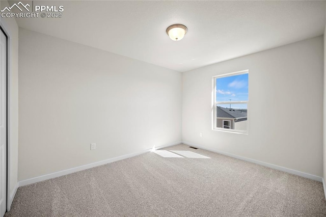 unfurnished room featuring carpet flooring