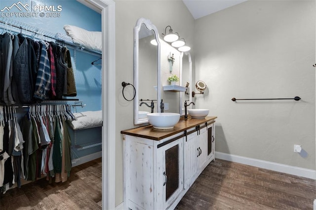 bathroom with vanity and hardwood / wood-style flooring