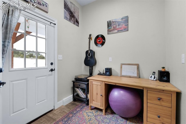 office space with wood-type flooring