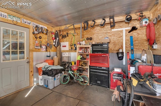 interior space featuring a workshop area and wood ceiling