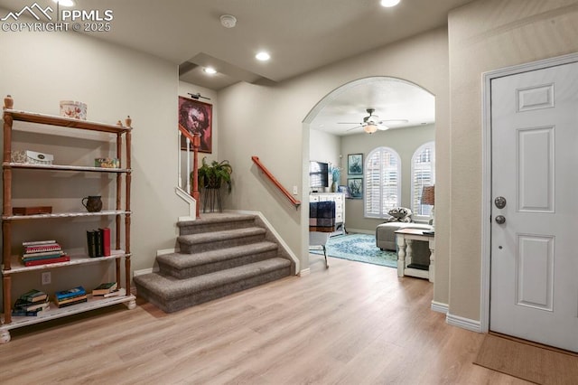 foyer entrance featuring light hardwood / wood-style flooring and ceiling fan