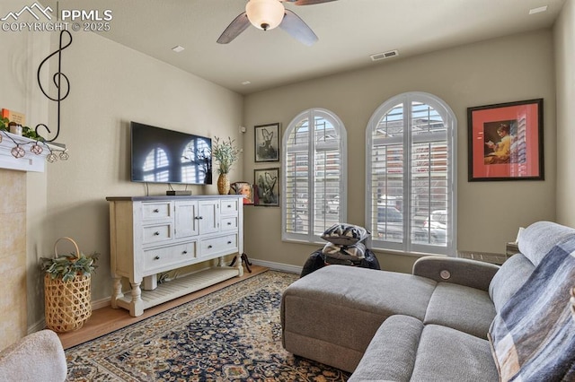 sitting room featuring ceiling fan