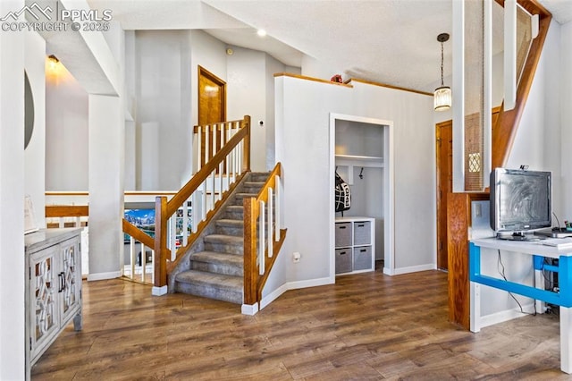 staircase featuring hardwood / wood-style floors