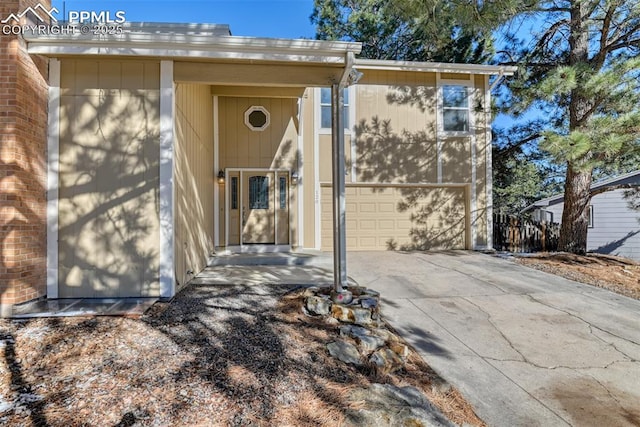 entrance to property featuring a garage