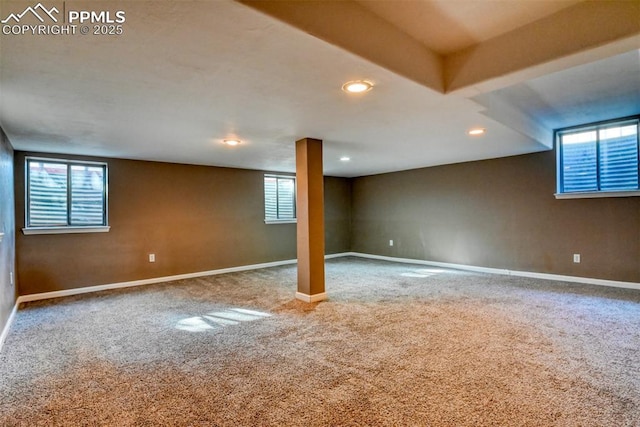 basement with carpet flooring and a wealth of natural light