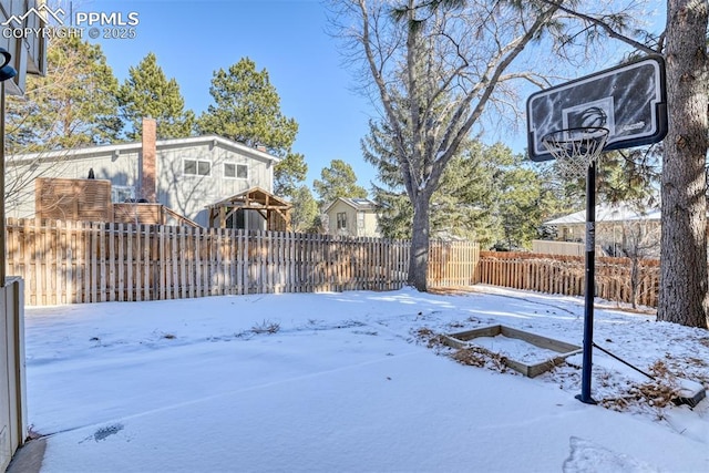 view of yard covered in snow