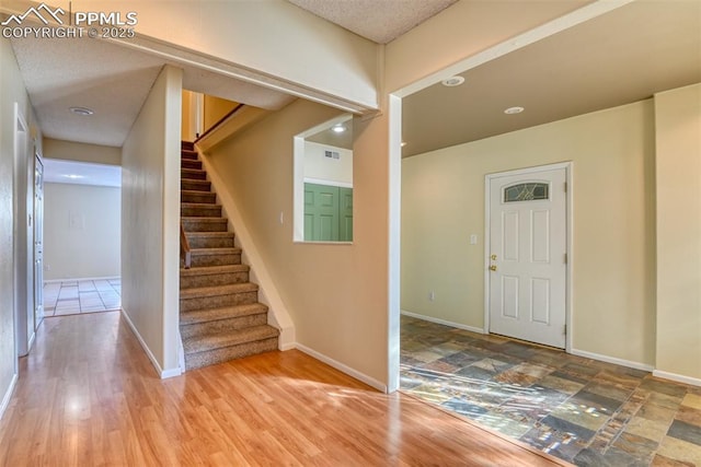 foyer entrance featuring hardwood / wood-style flooring