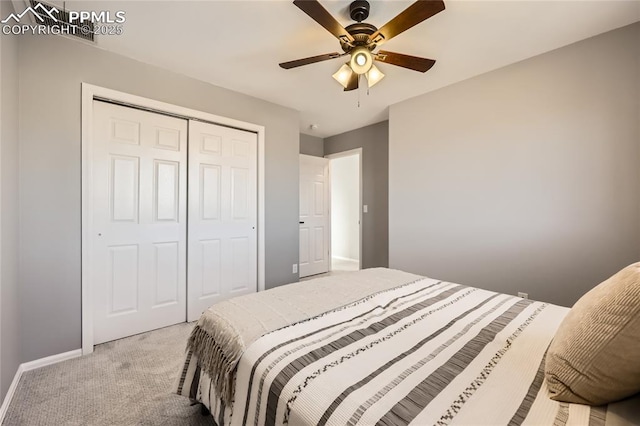 carpeted bedroom with a closet and ceiling fan