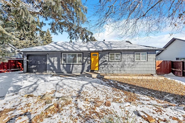 ranch-style home featuring a garage