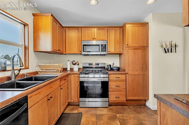 kitchen featuring sink and appliances with stainless steel finishes