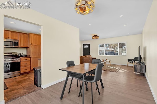 dining room with light hardwood / wood-style flooring