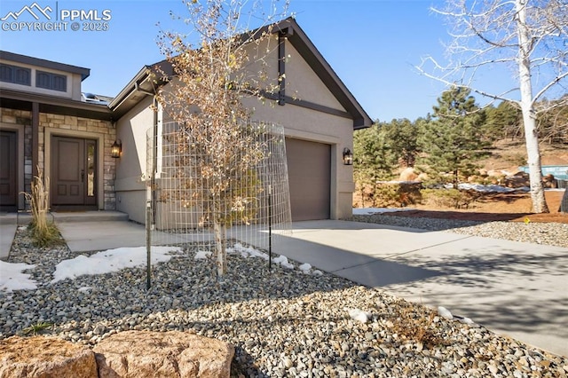 view of side of home featuring a garage