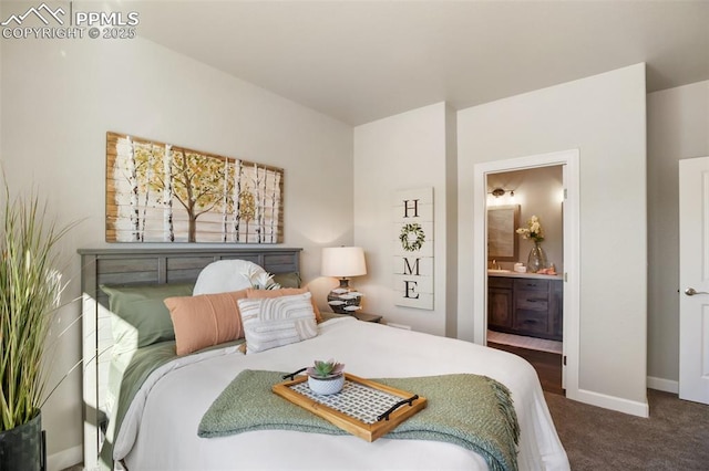 carpeted bedroom featuring ensuite bathroom