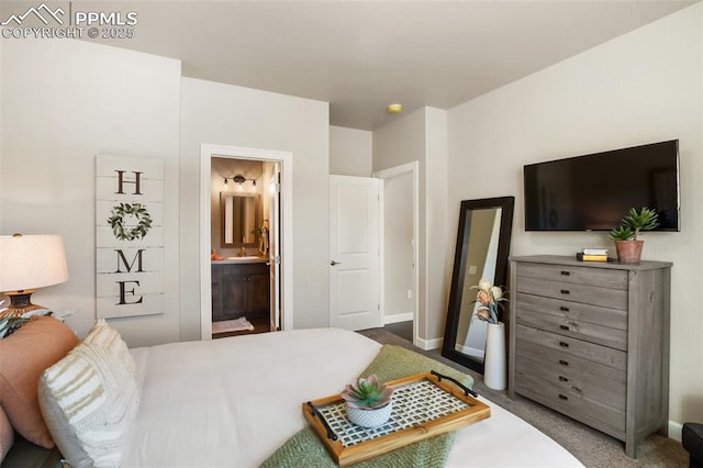 carpeted bedroom featuring ensuite bathroom