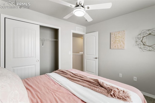 carpeted bedroom featuring a closet and ceiling fan