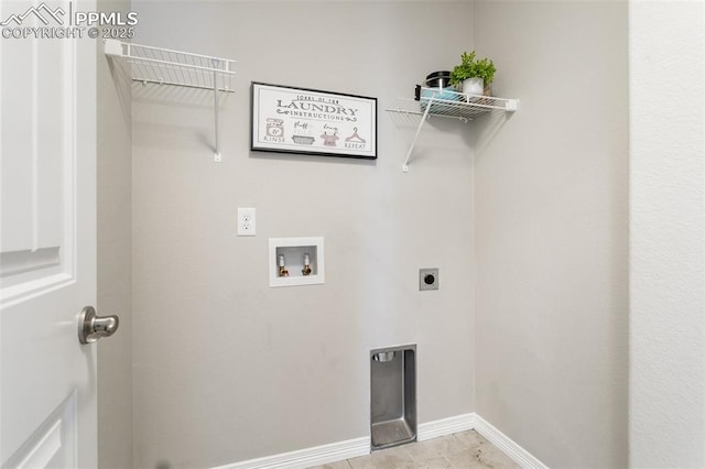 washroom featuring hookup for a washing machine, light tile patterned floors, and hookup for an electric dryer