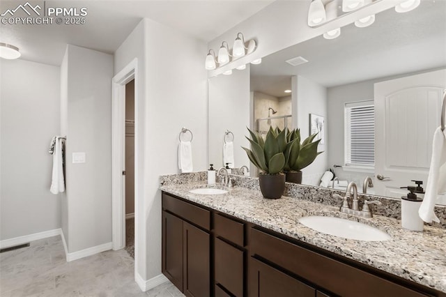 bathroom featuring vanity and walk in shower