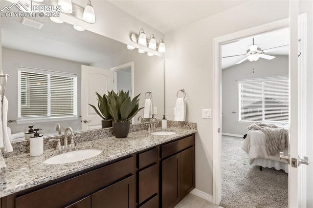 bathroom featuring vanity, vaulted ceiling, and ceiling fan