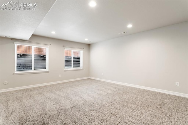 empty room with carpet flooring