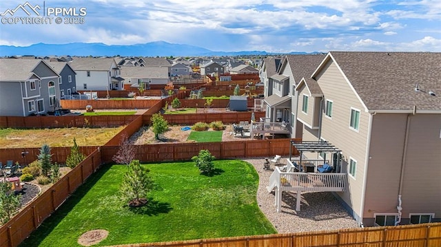 view of yard featuring a pergola, a patio area, and a mountain view