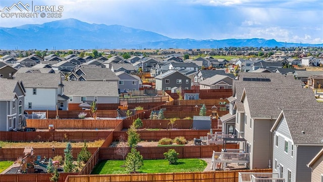 birds eye view of property featuring a mountain view