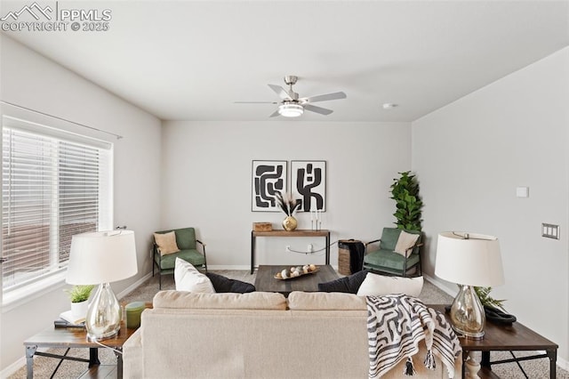 living room featuring wood-type flooring and ceiling fan