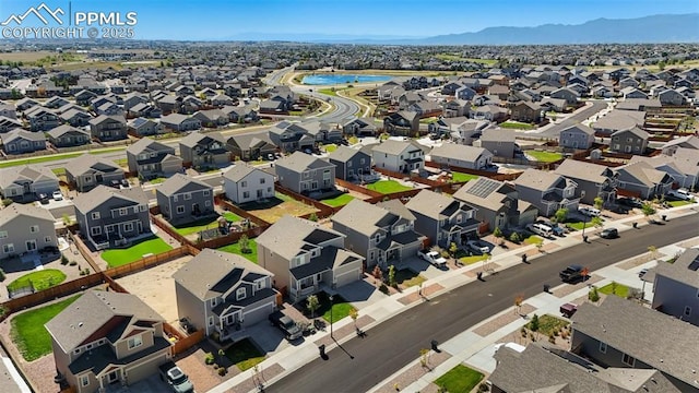 birds eye view of property featuring a mountain view