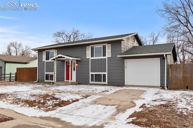 split foyer home featuring a garage