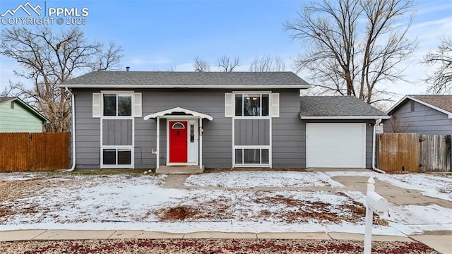 split foyer home featuring a garage