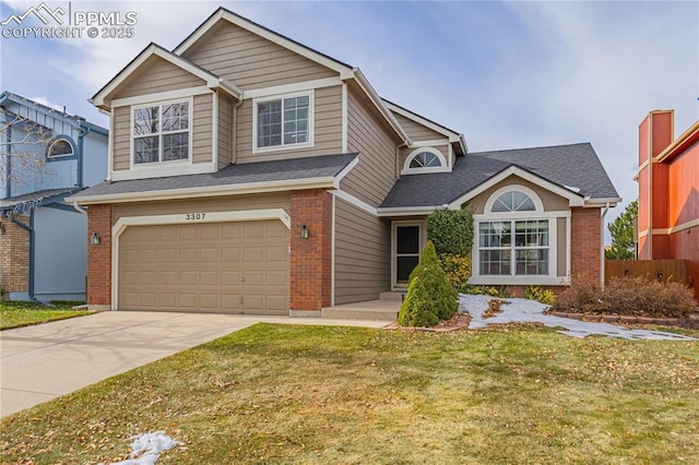 view of front of house featuring a garage and a front lawn