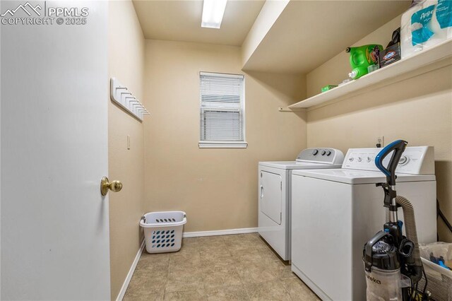 laundry room with washer and dryer