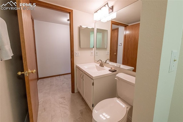 bathroom featuring vanity, toilet, and wood-type flooring